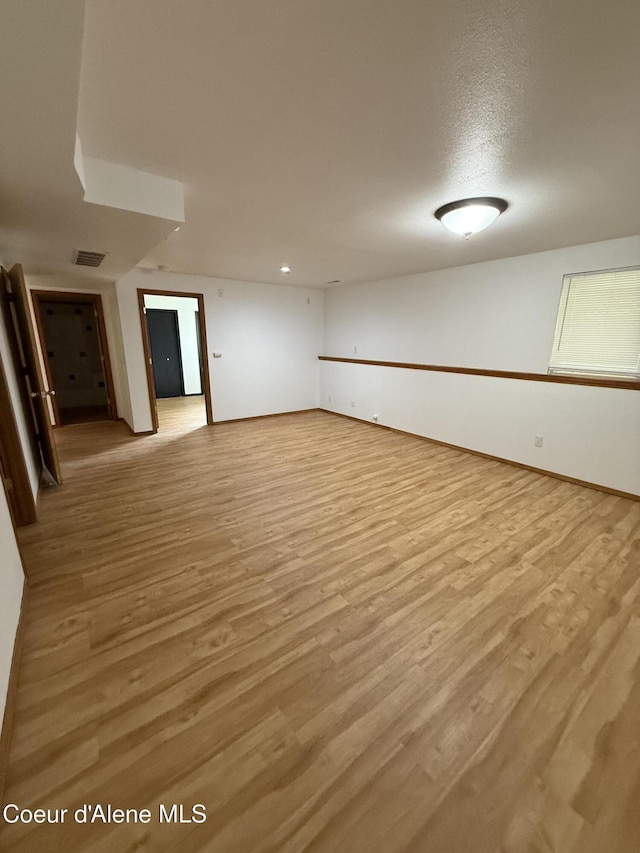 5188 E Woodland Dr, Post Falls, ID 83854 - empty room featuring light wood finished floors and baseboards