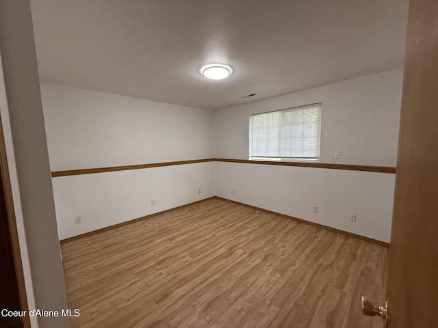 5188 E Woodland Dr, Post Falls, ID 83854 - unfurnished room with wood finished floors and baseboards