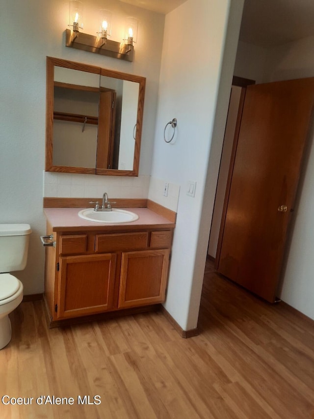 5188 E Woodland Dr, Post Falls, ID 83854 - bathroom with wood finished floors and vanity