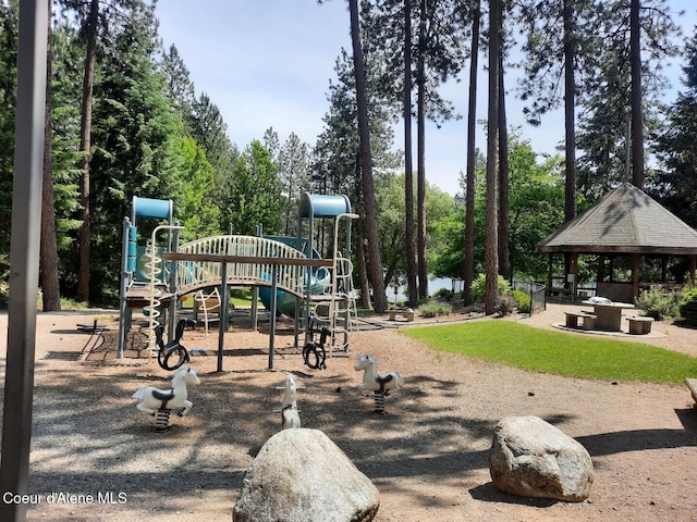5188 E Woodland Dr, Post Falls, ID 83854 - community play area featuring a gazebo and view of wooded area