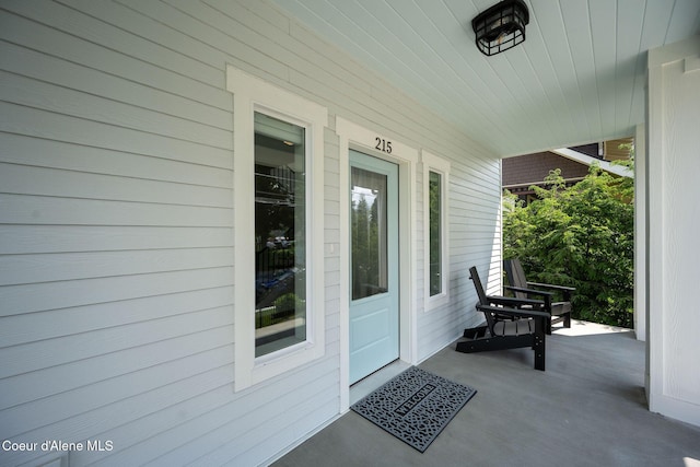 215 W Foster Ave, Coeur Dalene, ID 83814 - doorway to property featuring a porch