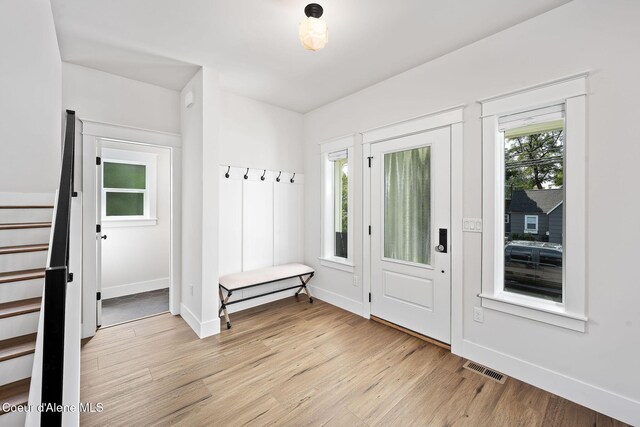 215 W Foster Ave, Coeur Dalene, ID 83814 - foyer featuring light wood-style flooring, stairway, and baseboards