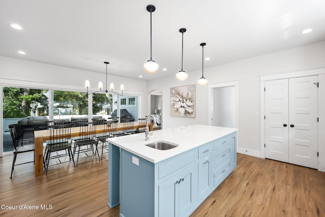 215 W Foster Ave, Coeur Dalene, ID 83814 - kitchen with a sink, light wood finished floors, recessed lighting, light countertops, and pendant lighting