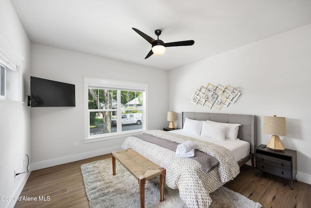 215 W Foster Ave, Coeur Dalene, ID 83814 - bedroom with wood finished floors, baseboards, and ceiling fan