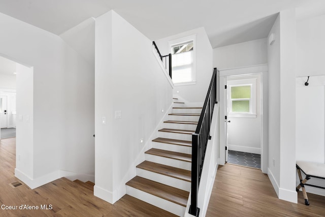 215 W Foster Ave, Coeur Dalene, ID 83814 - stairway with baseboards and wood finished floors