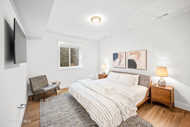 215 W Foster Ave, Coeur Dalene, ID 83814 - bedroom featuring light wood-type flooring and baseboards