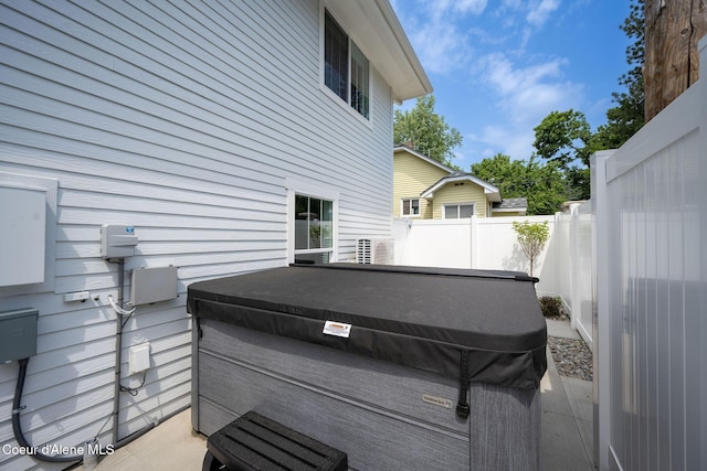 215 W Foster Ave, Coeur Dalene, ID 83814 - view of home's exterior featuring a hot tub and fence