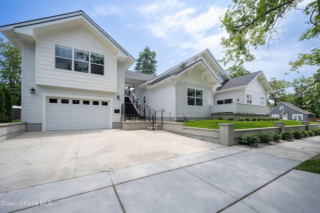 215 W Foster Ave, Coeur Dalene, ID 83814 - view of front facade with an attached garage and concrete driveway