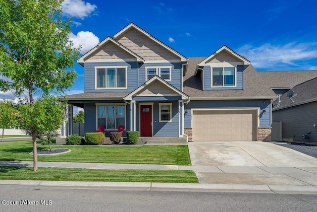 4631 E Alopex Ln, Post Falls, ID 83854 - craftsman-style home featuring concrete driveway, an attached garage, a front yard, stone siding, and roof with shingles