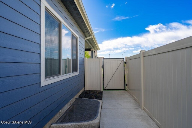 4631 E Alopex Ln, Post Falls, ID 83854 - view of property exterior with a gate and a patio