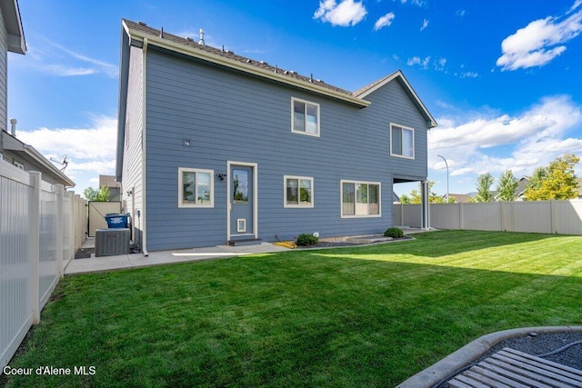 4631 E Alopex Ln, Post Falls, ID 83854 - rear view of property featuring central AC and a patio area