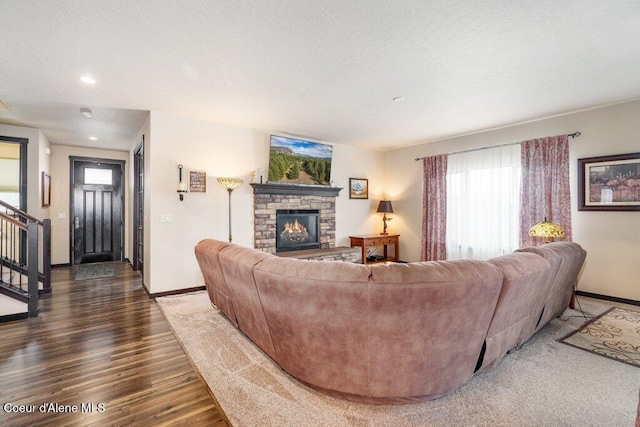 4631 E Alopex Ln, Post Falls, ID 83854 - living room with baseboards, wood finished floors, a fireplace, and recessed lighting