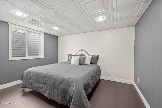 bedroom with an ornate ceiling, baseboards, and recessed lighting