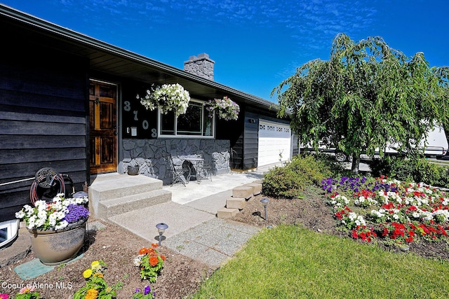 view of patio / terrace featuring an attached garage