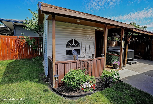 view of outbuilding featuring a hot tub