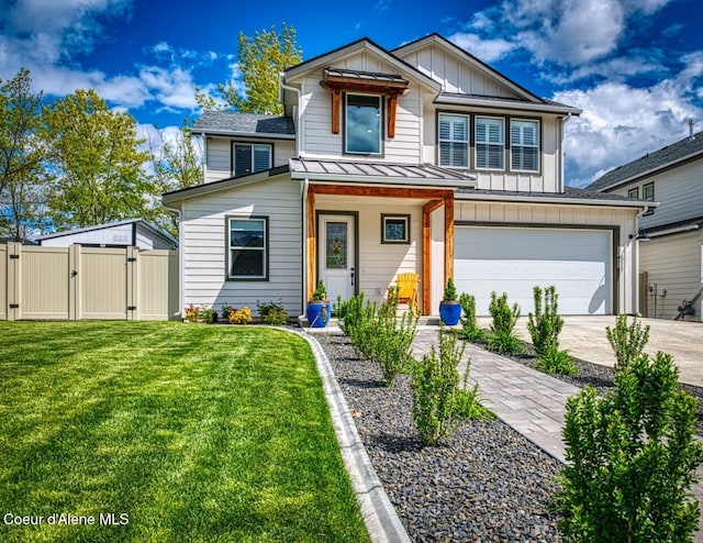 511 University Park Way, Sandpoint, ID 83864 - view of front facade featuring a gate, board and batten siding, driveway, an attached garage, and a standing seam roof