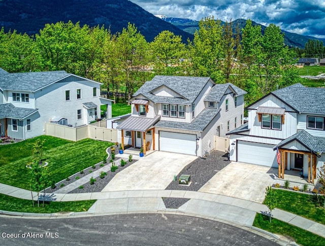 511 University Park Way, Sandpoint, ID 83864 - view of front of property featuring an attached garage, driveway, and a mountain view