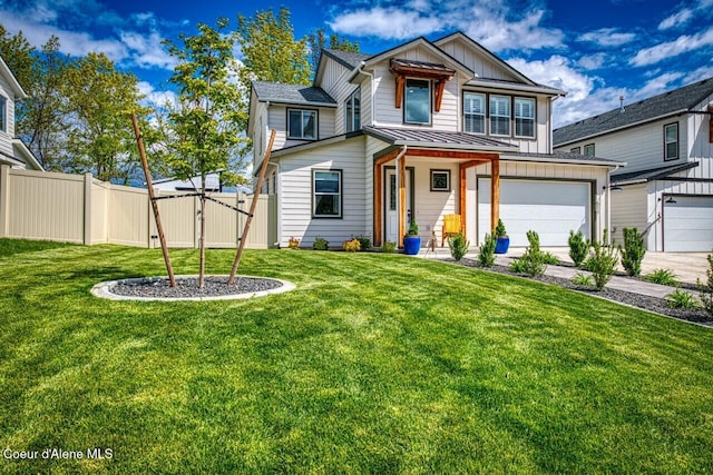 511 University Park Way, Sandpoint, ID 83864 - view of front of home featuring an attached garage, a gate, board and batten siding, a standing seam roof, and driveway