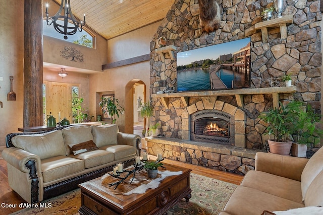 16829 S Lazurite Dr, Coeur Dalene, ID 83814 - living room with wood finished floors, high vaulted ceiling, arched walkways, wood ceiling, and a chandelier