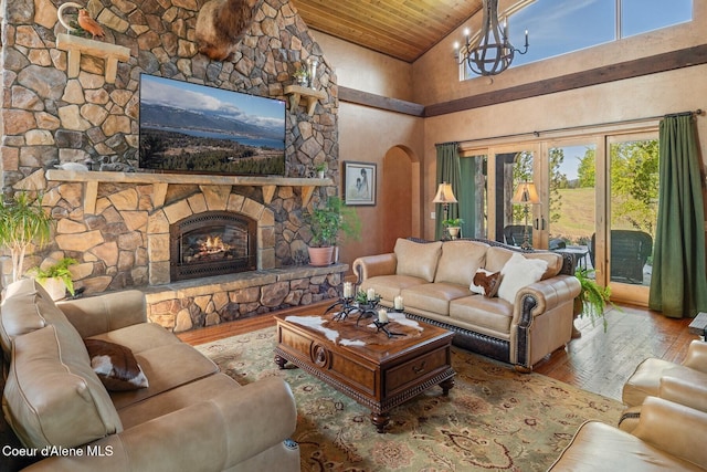 16829 S Lazurite Dr, Coeur Dalene, ID 83814 - living area featuring hardwood / wood-style floors, wooden ceiling, a chandelier, arched walkways, and high vaulted ceiling