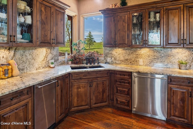 16829 S Lazurite Dr, Coeur Dalene, ID 83814 - kitchen with stainless steel dishwasher, a sink, decorative backsplash, and dark wood-style floors