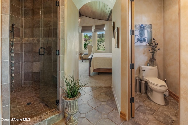 16829 S Lazurite Dr, Coeur Dalene, ID 83814 - bathroom with vaulted ceiling, a stall shower, ensuite bath, toilet, and tile patterned floors