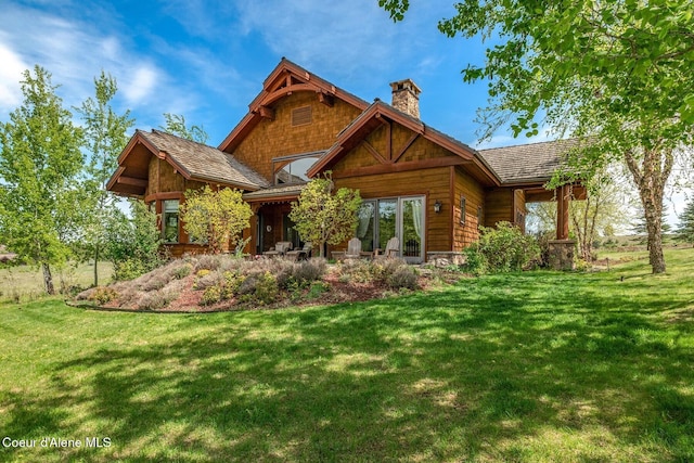 16829 S Lazurite Dr, Coeur Dalene, ID 83814 - view of front of house featuring a chimney and a front lawn