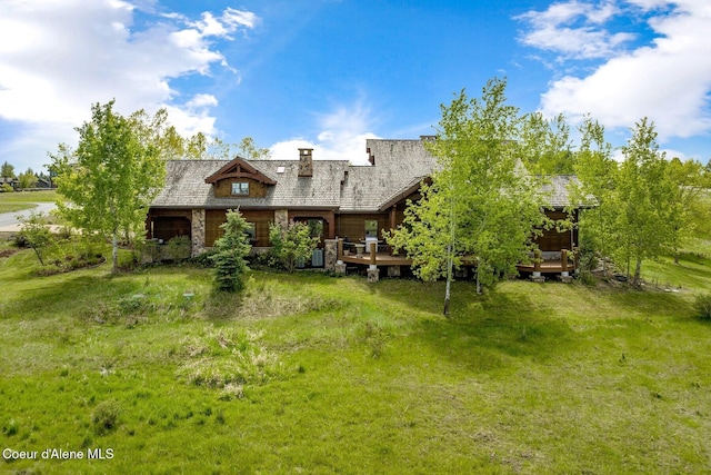 16829 S Lazurite Dr, Coeur Dalene, ID 83814 - rear view of property featuring a wooden deck and a yard