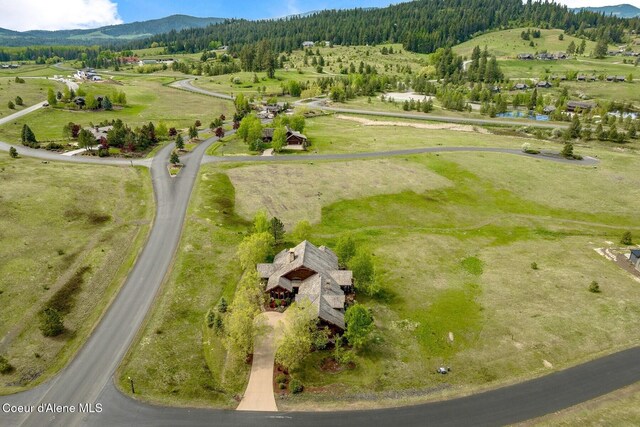 16829 S Lazurite Dr, Coeur Dalene, ID 83814 - aerial view of property and surrounding area with mountains and a forest