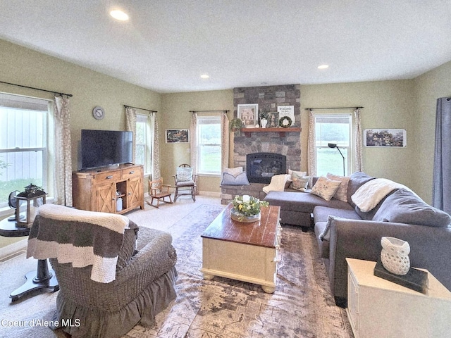 29429 N Silver Meadows Loop, Athol, ID 83801 - living area featuring recessed lighting, a stone fireplace, and a textured ceiling