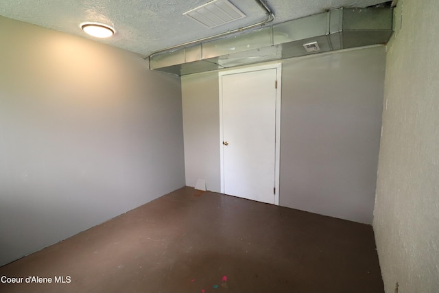 below grade area with a textured ceiling