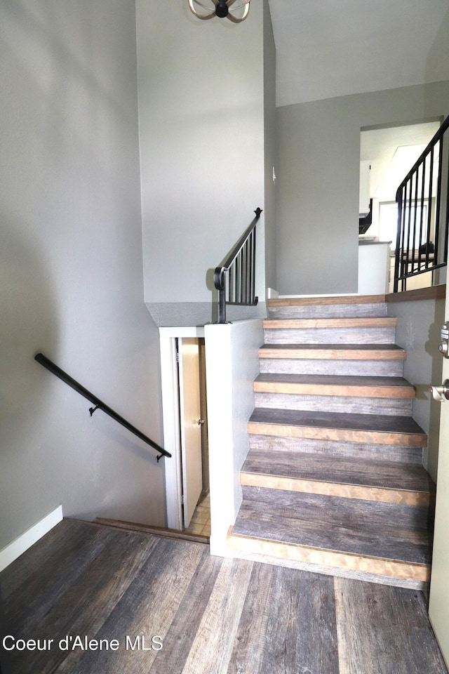stairway featuring wood finished floors