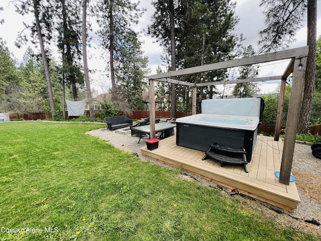 8351 N Audubon Dr, Hayden, ID 83835 - view of yard with a hot tub and a deck