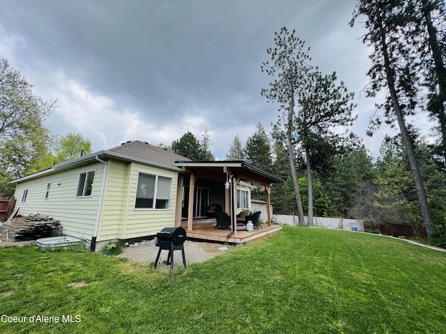 8351 N Audubon Dr, Hayden, ID 83835 - back of property with a wooden deck