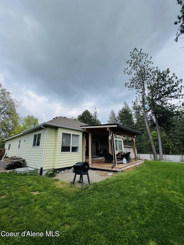8351 N Audubon Dr, Hayden, ID 83835 - rear view of property with a wooden deck
