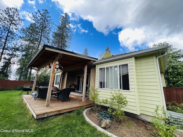 8351 N Audubon Dr, Hayden, ID 83835 - rear view of property featuring a wooden deck