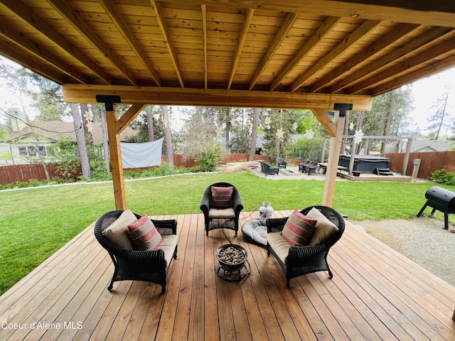 8351 N Audubon Dr, Hayden, ID 83835 - wooden deck featuring a hot tub and an outdoor living space with a fire pit