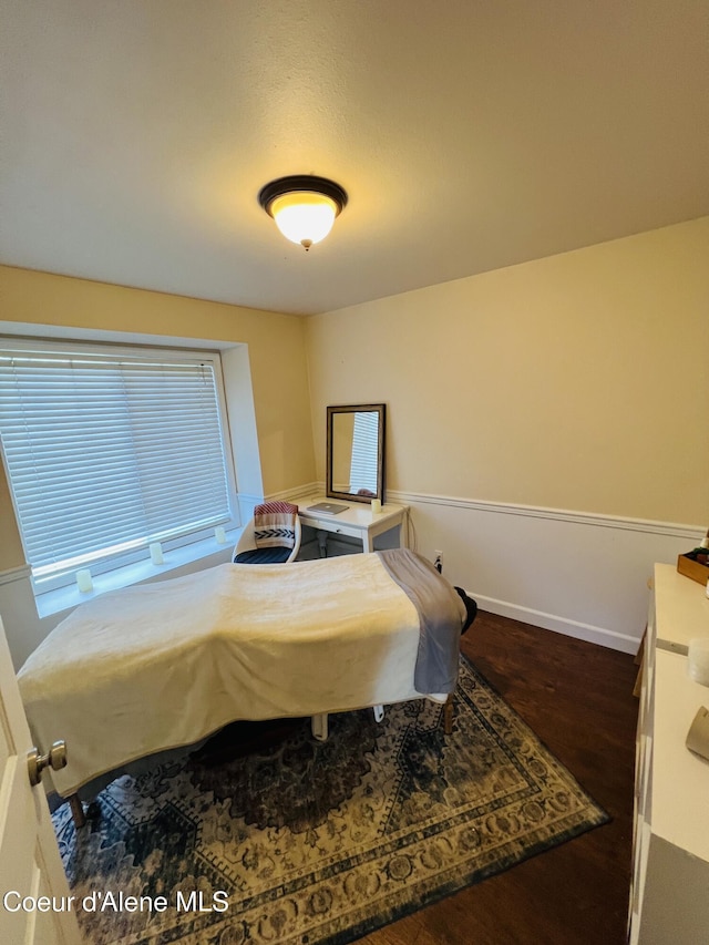 8351 N Audubon Dr, Hayden, ID 83835 - bedroom with dark wood-style floors and baseboards