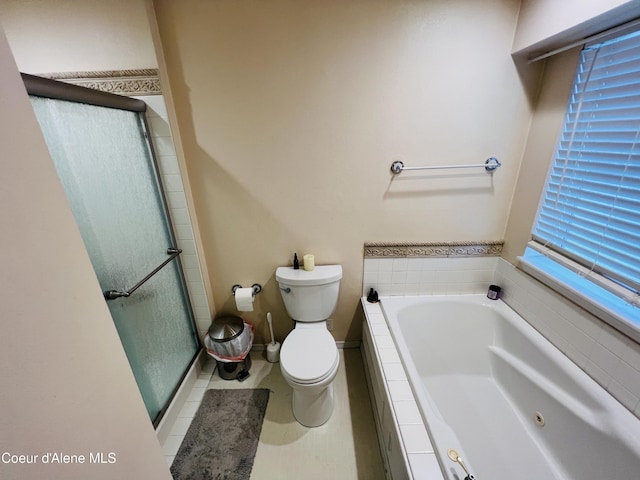 8351 N Audubon Dr, Hayden, ID 83835 - full bath featuring a stall shower, toilet, a garden tub, and tile patterned flooring