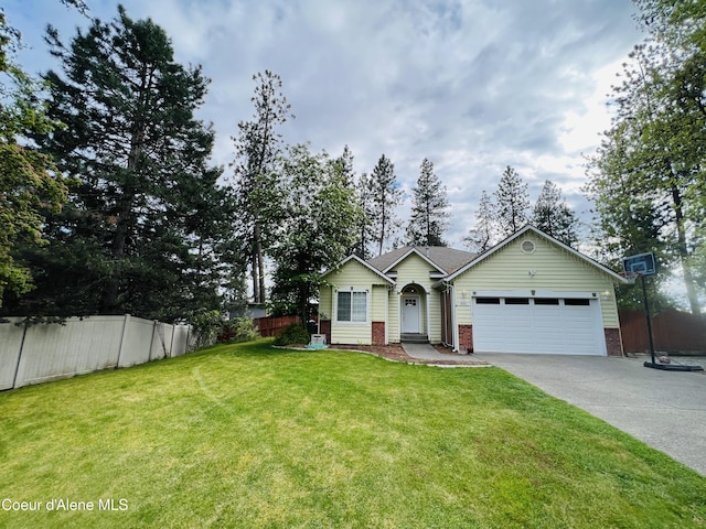 8351 N Audubon Dr, Hayden, ID 83835 - view of front of house with an attached garage, driveway, and brick siding