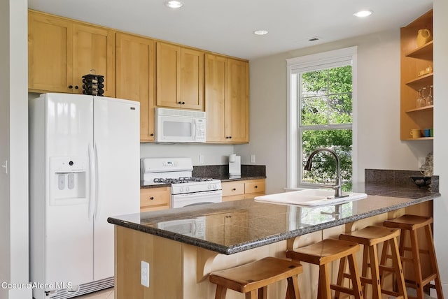500 Guthrie Pl Unit 1303, Dover, ID 83825 - kitchen featuring white appliances, a sink, open shelves, a peninsula, and recessed lighting