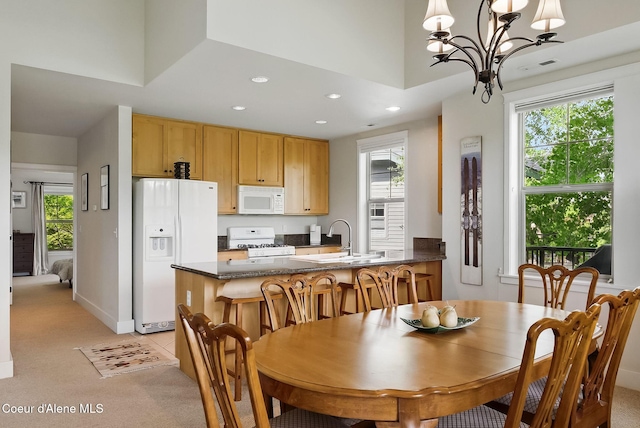 500 Guthrie Pl Unit 1303, Dover, ID 83825 - dining space with a chandelier, recessed lighting, light colored carpet, and healthy amount of natural light