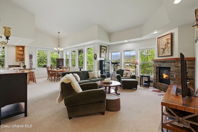 500 Guthrie Pl Unit 1303, Dover, ID 83825 - living area featuring light colored carpet, a stone fireplace, healthy amount of natural light, recessed lighting, and lofted ceiling