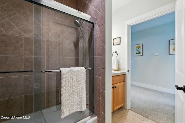500 Guthrie Pl Unit 1303, Dover, ID 83825 - full bath with a stall shower, vanity, tile patterned floors, and baseboards