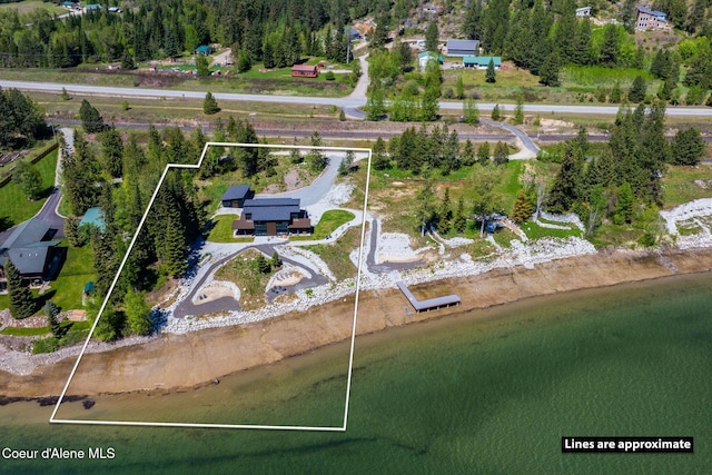 55 S Thistle Down Ln, Laclede, ID 83841 - aerial view of property and surrounding area featuring property boundaries highlighted and a nearby body of water