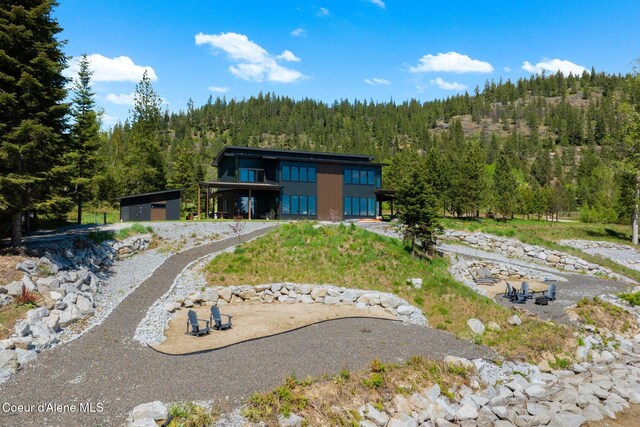 55 S Thistle Down Ln, Laclede, ID 83841 - back of house with a forest view
