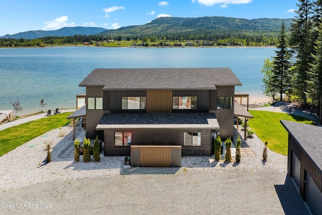 55 S Thistle Down Ln, Laclede, ID 83841 - view of front of property with a water and mountain view and a shingled roof