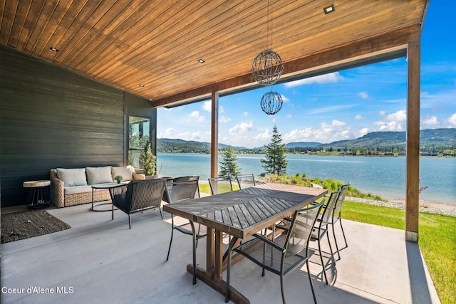55 S Thistle Down Ln, Laclede, ID 83841 - view of patio featuring a water and mountain view, an outdoor living space, and outdoor dining area