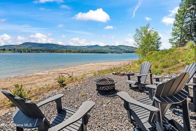 55 S Thistle Down Ln, Laclede, ID 83841 - water view featuring an outdoor fire pit and a mountainous background