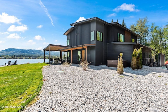 55 S Thistle Down Ln, Laclede, ID 83841 - back of property with a yard and a water and mountain view